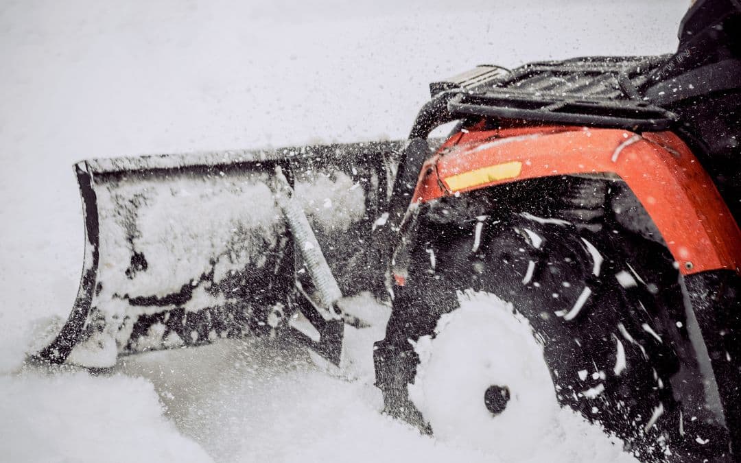 ATV with snow plow attached